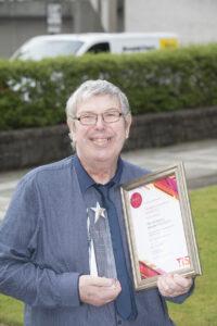 Photo of Paul McMenemy with his award