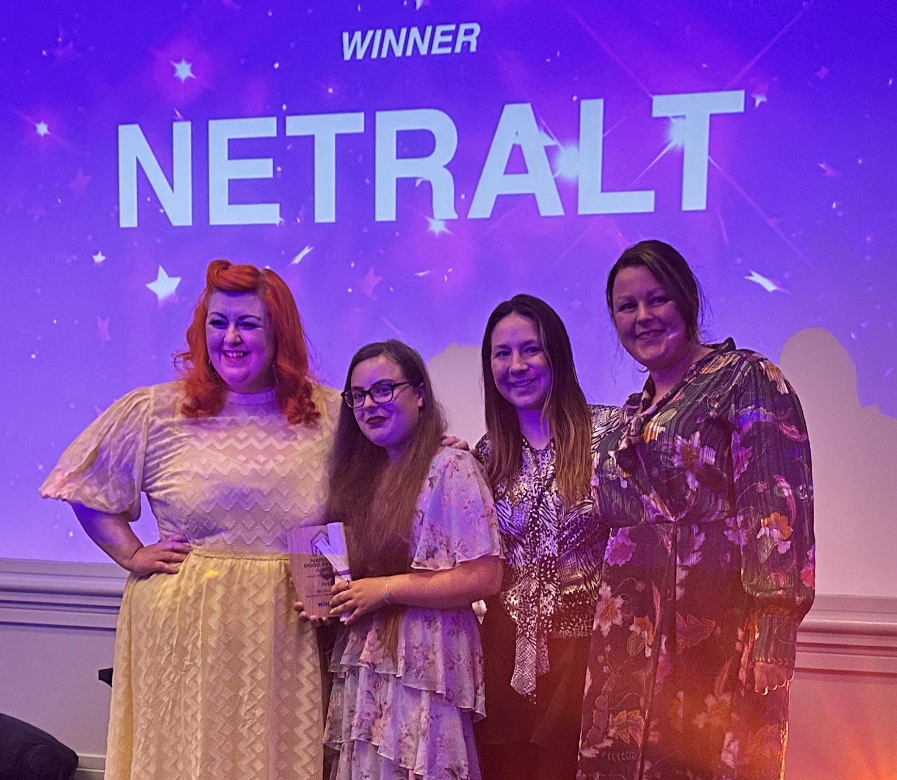 2307 NETRALT TPAS award photo of NETRALT collecting award from Michelle McManus